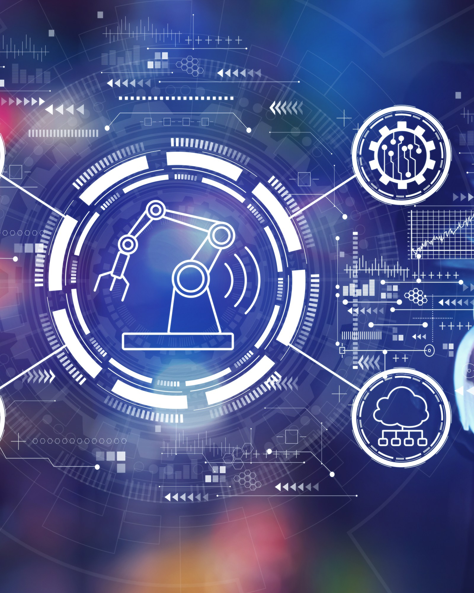 A businessman’s hand reaching toward glowing automation icons: a robot arm, gears, a factory, Wi-Fi and the cloud