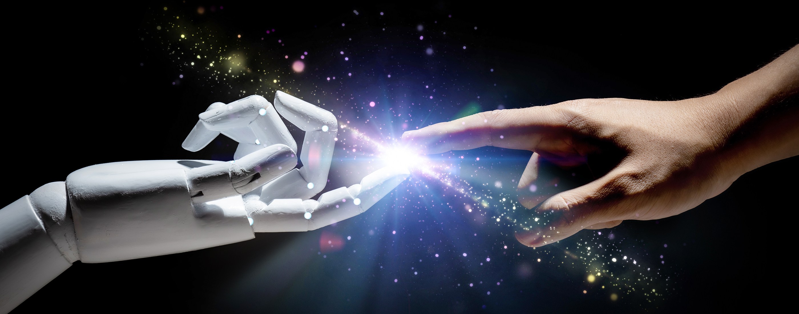 A human finger reaching to touch the finger of a white robotic hand, a spark of light between them on a dark background