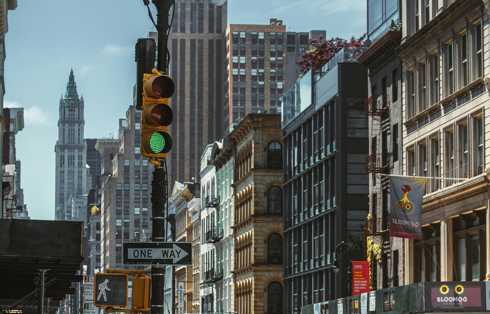 A SoHo street in Manhattan with traffic lights and old buildings