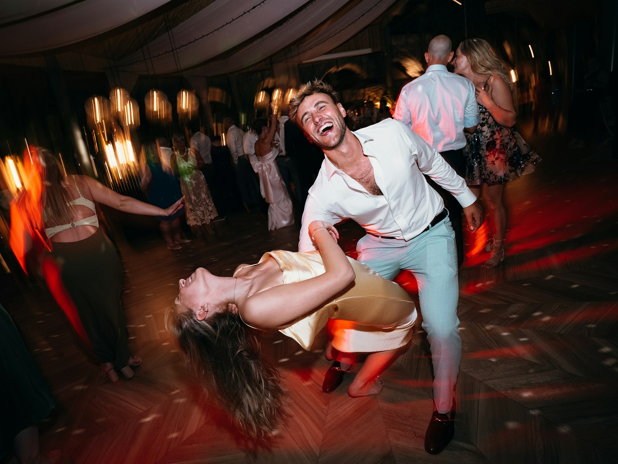 Wedding guests dancing at a reception