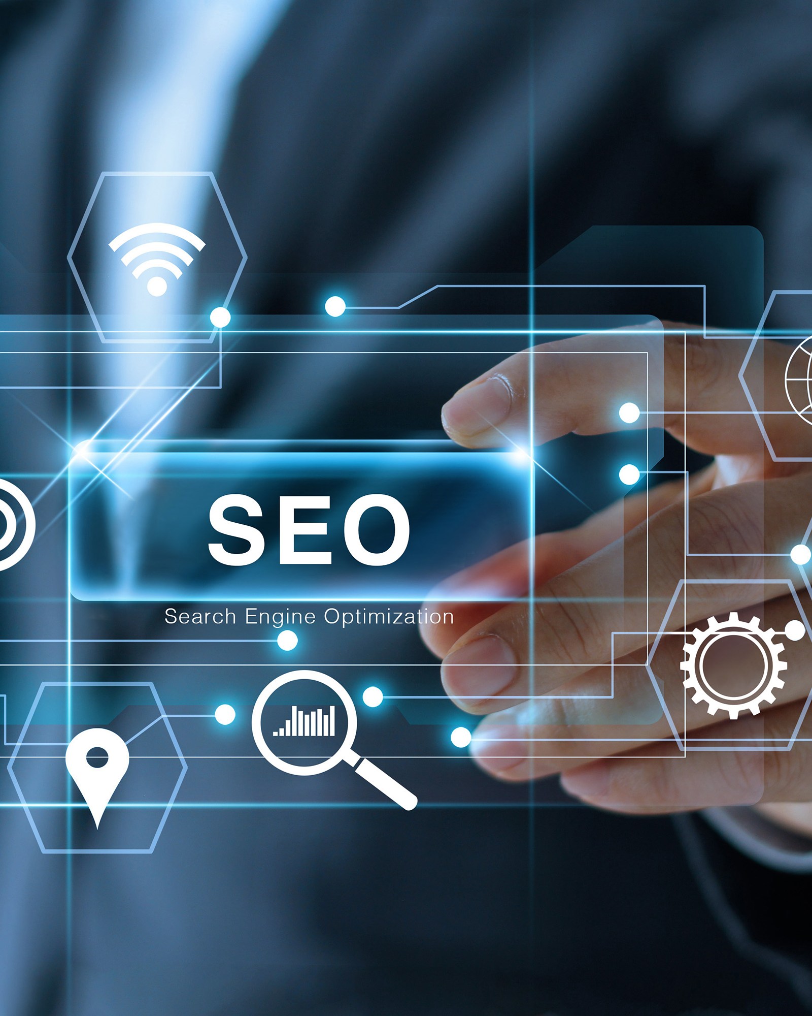 A businessman&rsquo;s hand reaching toward a glowing SEO search engine optimization screen surrounded by search and marketing icons