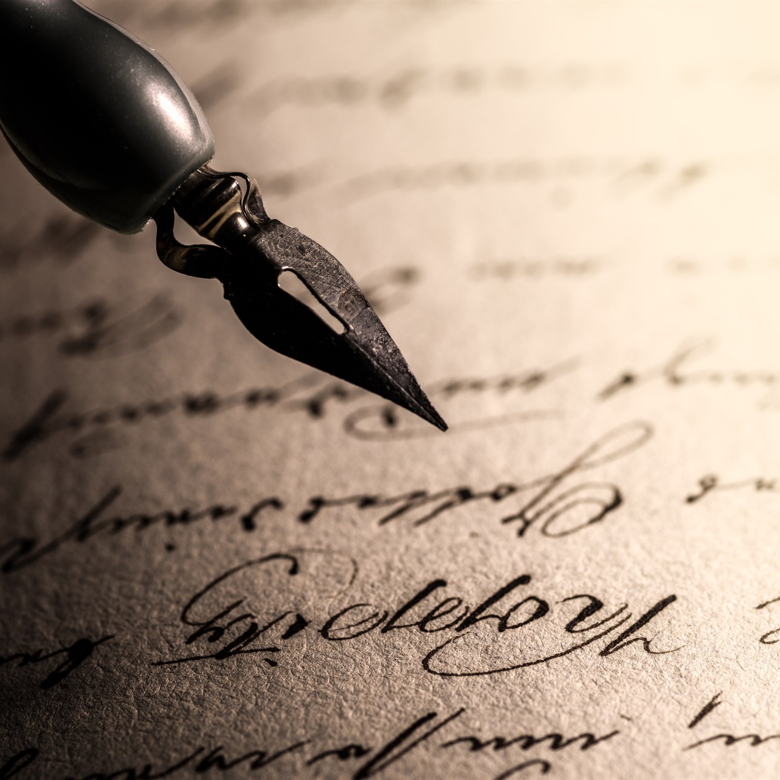 A writer drafting copy in a notebook