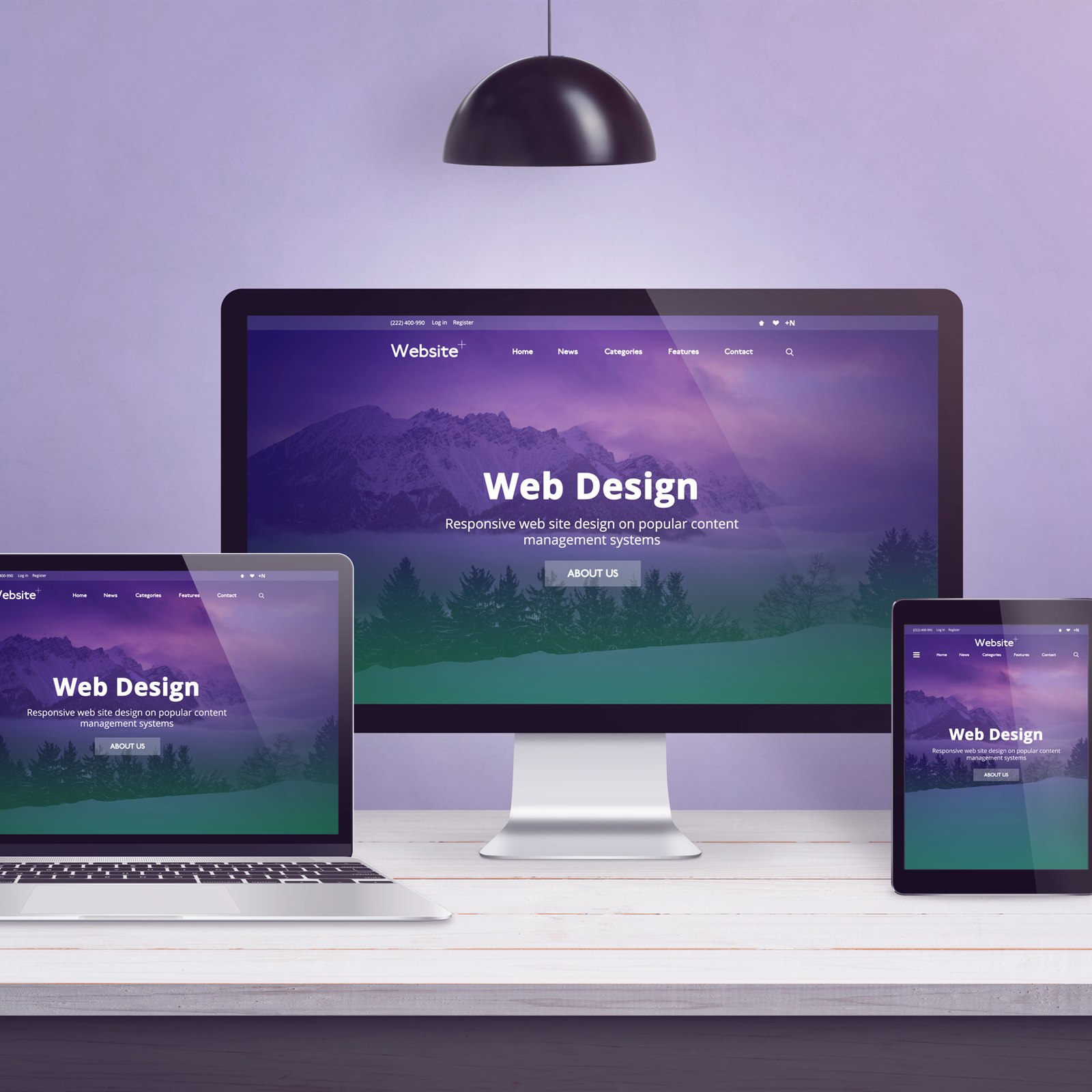 A sleek desk with a large screen showing a website design