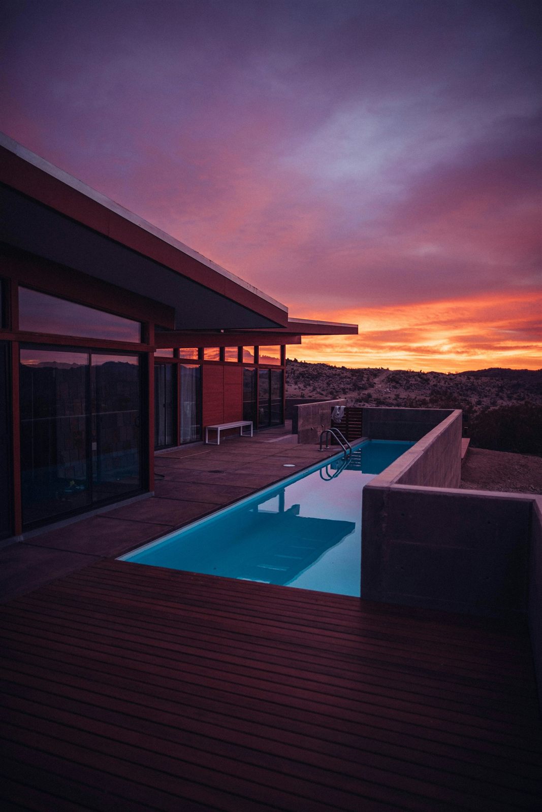 A modern home and pool at golden hour